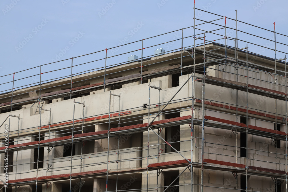 building under construction with scaffolding building under construction with scaffolding