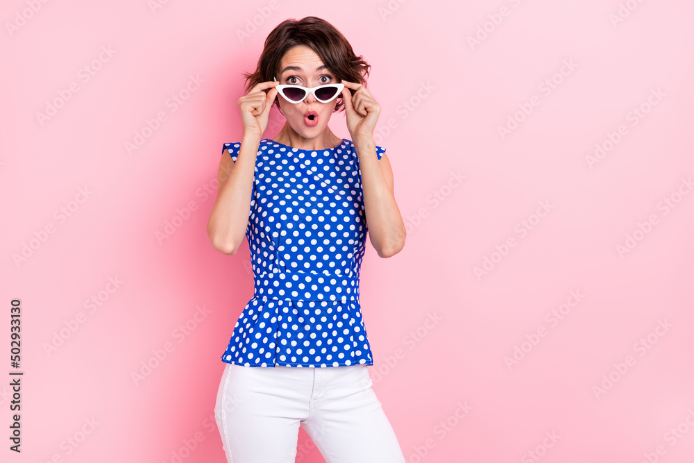 Photo of impressed millennial brunette lady open mouth wear glasses blouse jeans isolated on pink color background Photo of impressed millennial brunette lady open mouth wear glasses blouse jeans isolated on pink color background