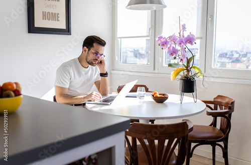 Man working at home using laptop. © Zoran Zeremski