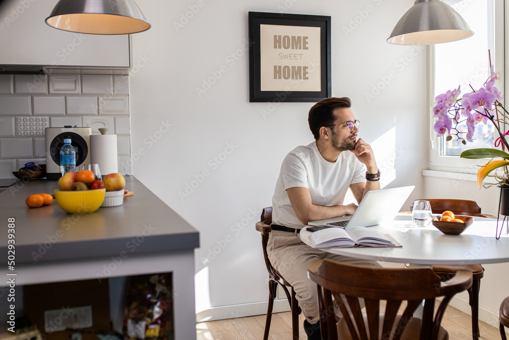 Man working at home using laptop. Man working at home using laptop.