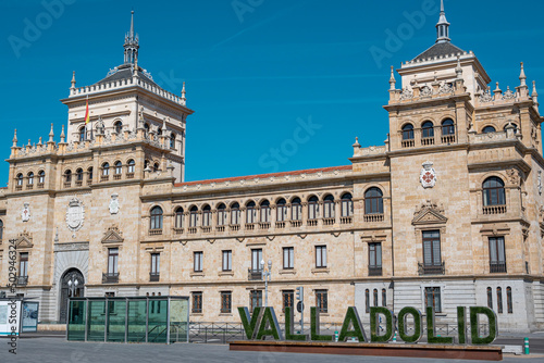 Palabra con el nombre de la ciudad Valladolid y edificio de la academia de caballería de fondo, España photo