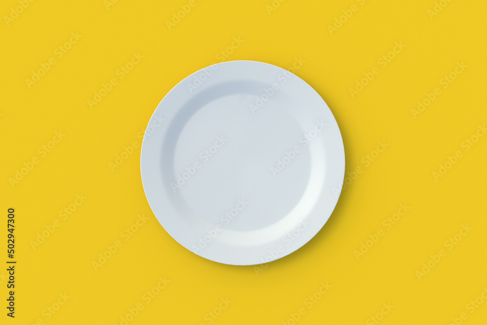 Empty plate on yellow background. Top view. 3d render Empty plate on yellow background. Top view. 3d render