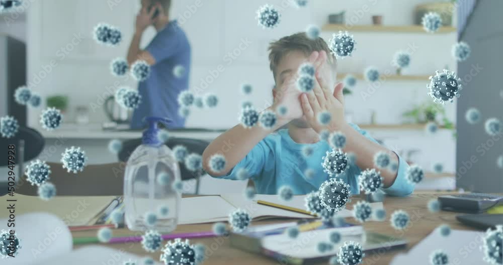 Animation of virus cells over caucasian father and son learning at home Animation of virus cells over caucasian father and son learning at home