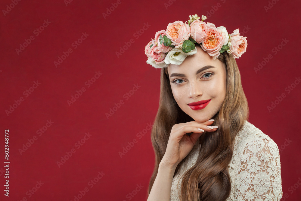 Portrait of a young brunette woman in flowers. Woman's face with makeup and hairstyle