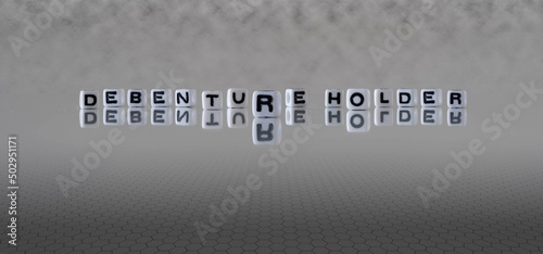 debenture holder word or concept represented by black and white letter cubes on a grey horizon background stretching to infinity photo