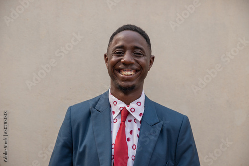 Young smiling guy isolated, portrait of an elegant african businessman. photo