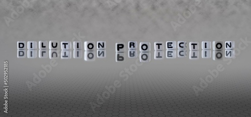 Foto dilution protection word or concept represented by black and white letter cubes