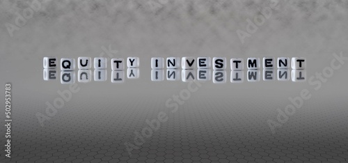 equity investment word or concept represented by black and white letter cubes on a grey horizon background stretching to infinity