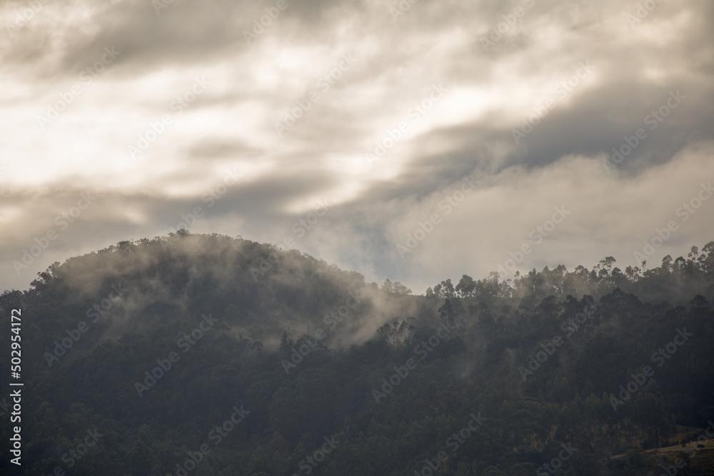 Hazy and misty sunrise over the farmlands at the Andean central mountains of Colombia near the town of Arcabuco