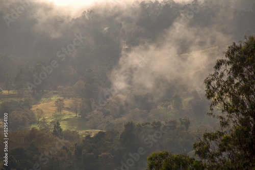 Hazy and misty sunrise over the farmlands at the Andean central mountains of Colombia near the town of Arcabuco