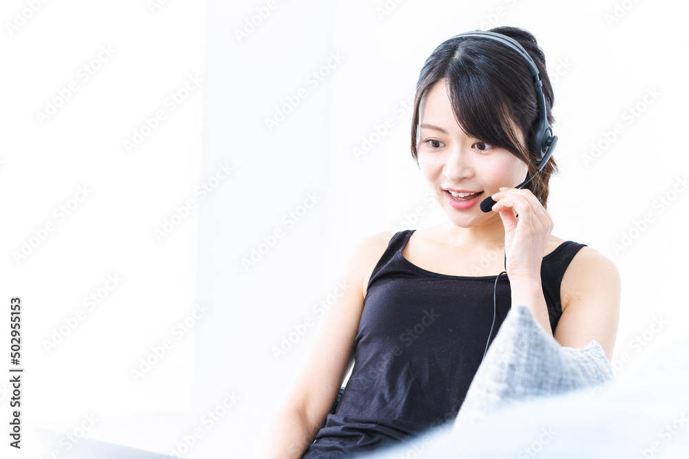 A woman taking an online lesson A woman taking an online lesson