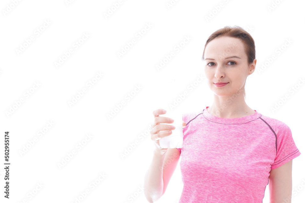Young woman wearing sportswear drinking water Young woman wearing sportswear drinking water