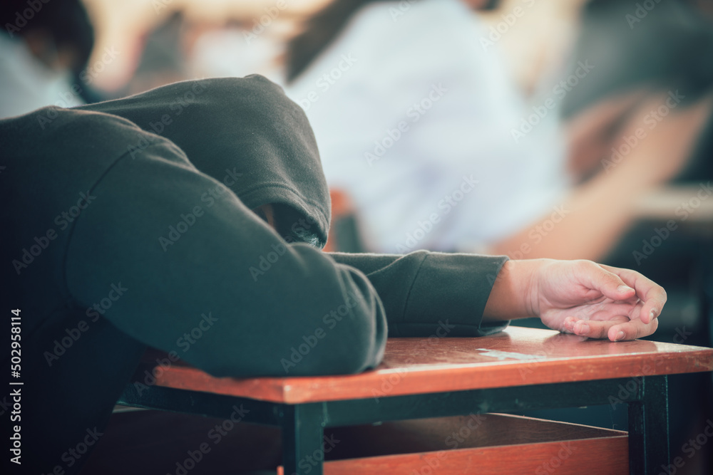 Image showcasing Tired students sleeping during exam test in classroom Stock Photo ...