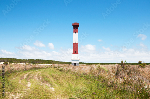 View of sarita lighthouse with blue sky and clouds in the 