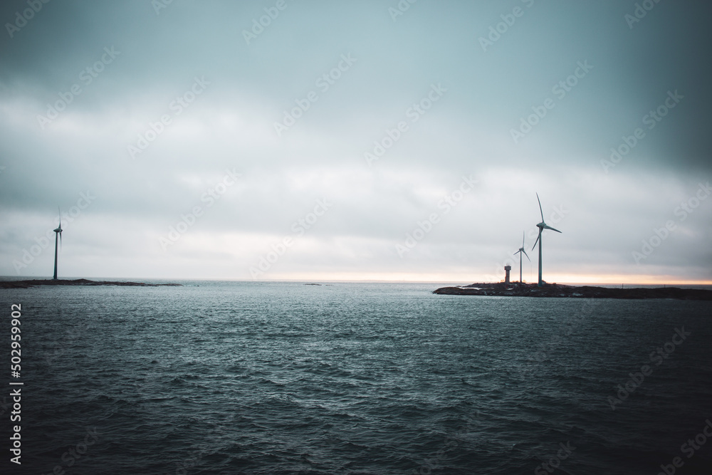 ocean sea  winter island  windmills without person