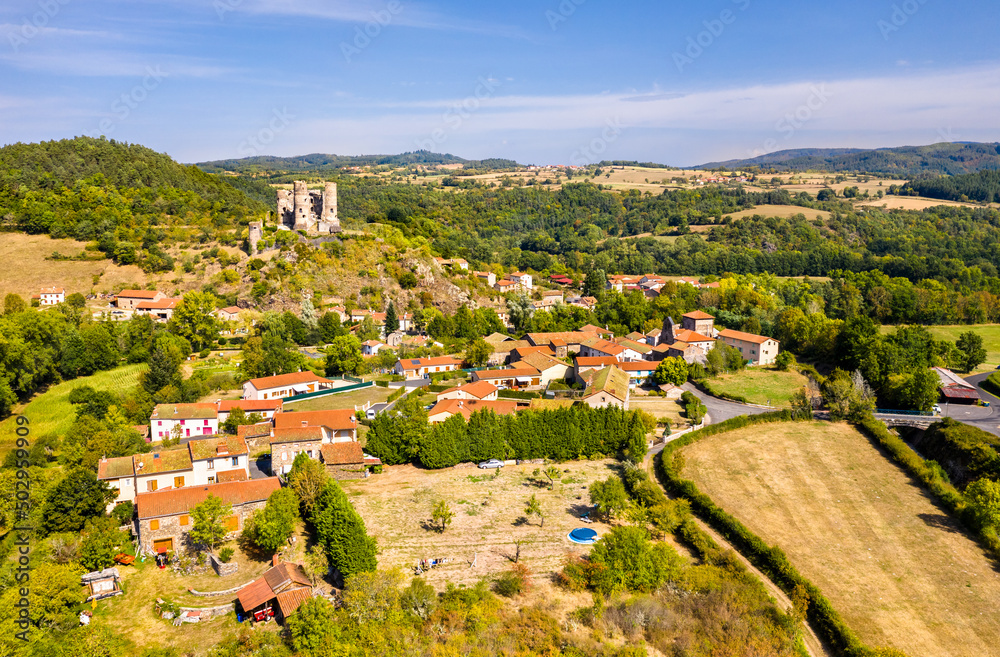 Aerial view of Domeyrat village with its castle in Auvergne, France