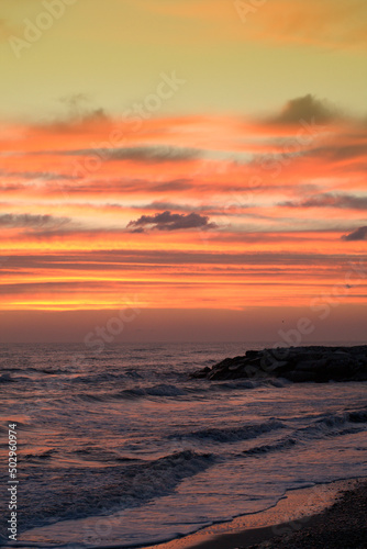 sunset in the sea sunrise  water  sun  ocean  clouds  sunset  sky  sea beautiful  coast  evening  sunlight  orange cloud  horizon nature 