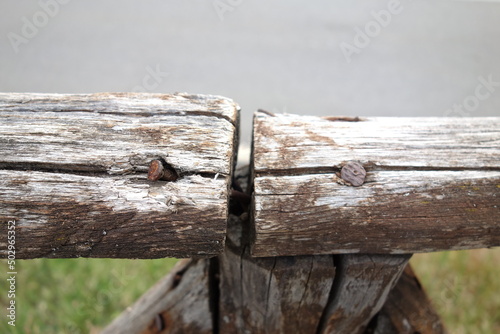 An old wooden handrail outside