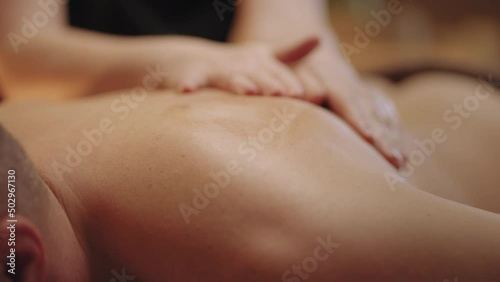 Wallpaper Mural massage for male client in spa salon or osteopathic clinic, woman masseuse is massaging back of young man Torontodigital.ca