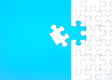 The last piece of the jigsaw puzzle to complete the mission on a blue background.	