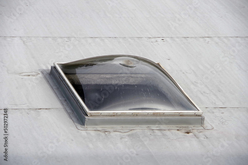 A skylight window in a flat roof seen from above