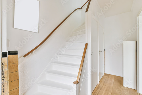 White staircase in light apartment photo