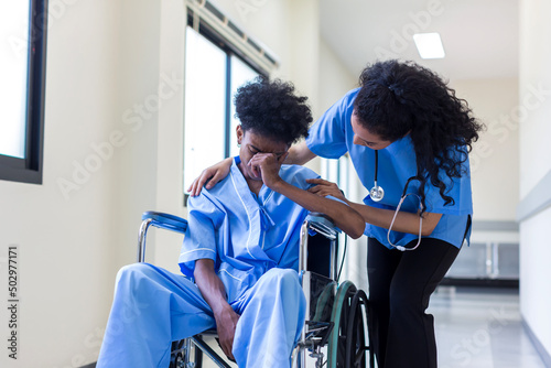 Patients sitting on wheelchairs have depression. Man patient in a wheelchair is discouraged photo