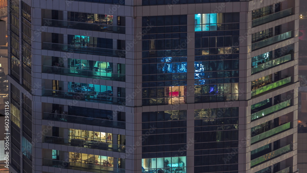 Windows in high-rise building exterior in the late evening with interior lights on timelapse Windows in high-rise building exterior in the late evening with interior lights on timelapse