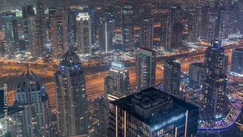 JLT and Dubai Marina skyscrapers intersected by Sheikh Zayed Road night timelapse