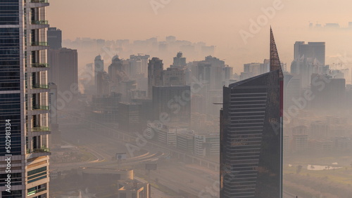 Photography Dubai Aerial view showing fog over al barsha heights and greens district area ti