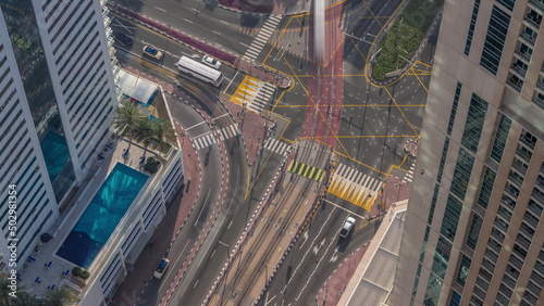 Aerial view of a road intersection between skyscrapers in a big city timelapse.