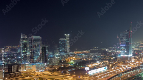 Highway crossroad and office buildings in Dubai Internet City and Media City district aerial night timelapse © neiezhmakov