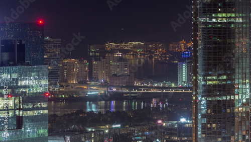 Office buildings in Dubai Internet City and Media City district aerial night timelapse