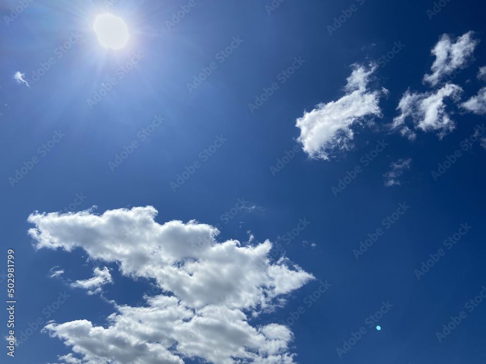 White, fluffy clouds in blue sky. Background from clouds. Beauty clear cloudy in sunshine. White, fluffy clouds in blue sky. Background from clouds. Beauty clear cloudy in sunshine.