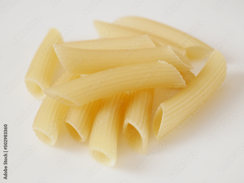 Raw pasta set, background farfalle on white background Raw pasta set, background farfalle on white background