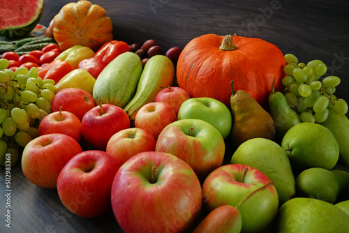 many different fruit and vegetables  green glocery shop  healthy fresh colored fruits and vegetables background delivery