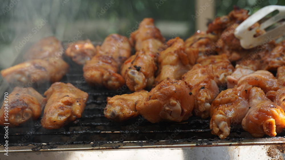 Fresh chicken steak grill meat on fire. Making barbecue on the grill Fresh chicken steak grill meat on fire. Making barbecue on the grill