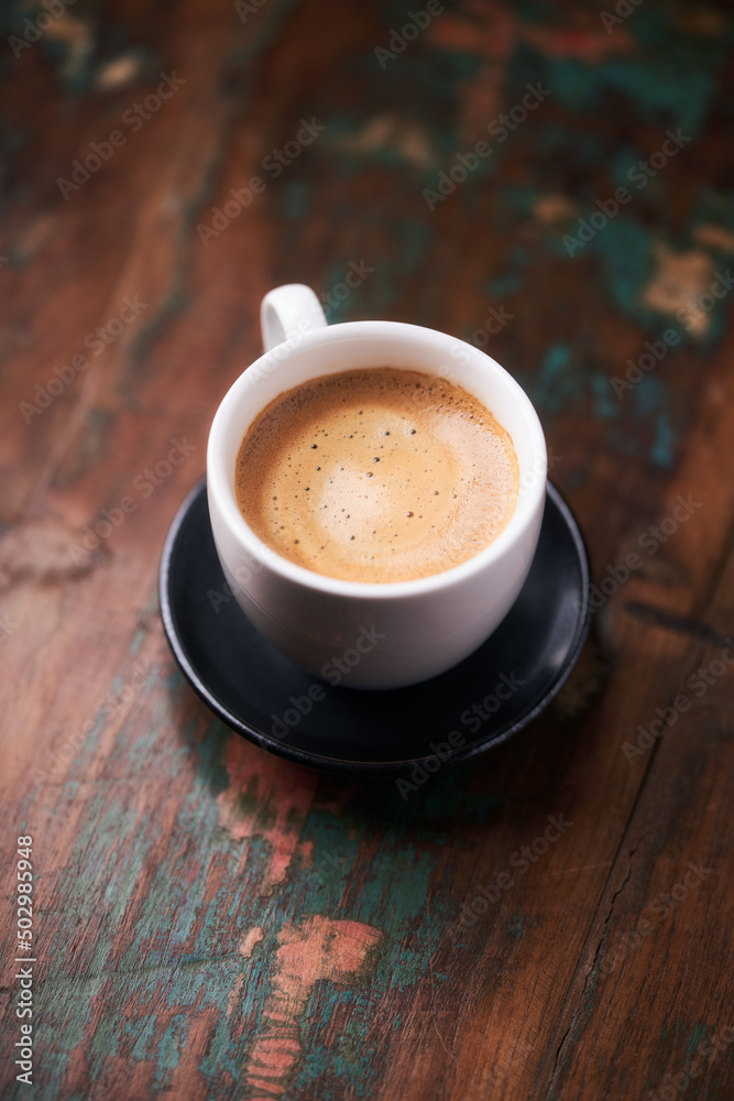 Cup of coffee on rustic wooden background. Copy space. Cup of coffee on rustic wooden background. Copy space.