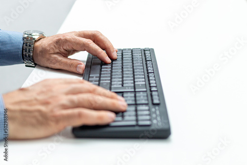 Close up of businessman hands typing on computer keyboard.Business, education, programming...