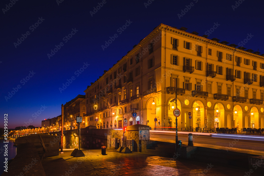 Turin, Italy. February 15, 2022. View of the historical buildings of the Lungo Po Armando Diaz near Piazza Vittorio Veneto in the evening after sunset.