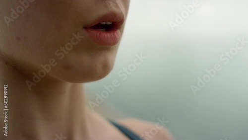Unknown girl inhaling exhaling practicing yoga meditation on nature close up.
