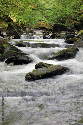 Small waterfall on the East Lyn river  Devon England 