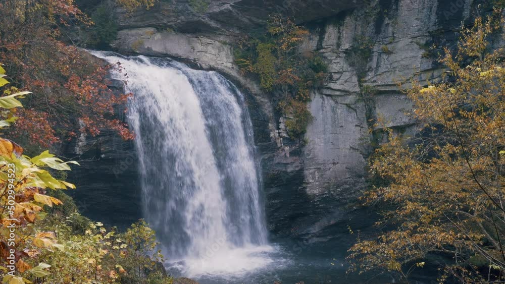 Looking Glass Falls in the Fall. Large Waterfall in Pisgah National Forest near Asheville, North Carolina Looking Glass Falls in the Fall. Large Waterfall in Pisgah National Forest near Asheville, North Carolina