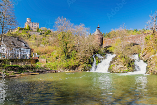 Pyrmonter Wasserfall mit Burg und Mühle, Eifel, Rheinland-Pfalz, Deutschland photo