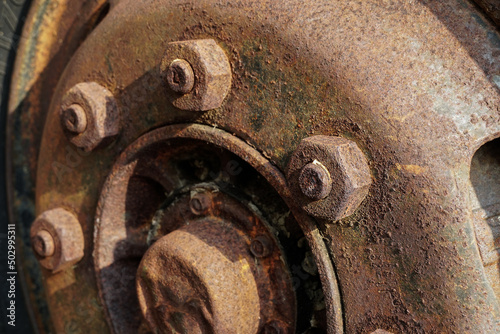 The wheels of an old truck rusted and corroded.