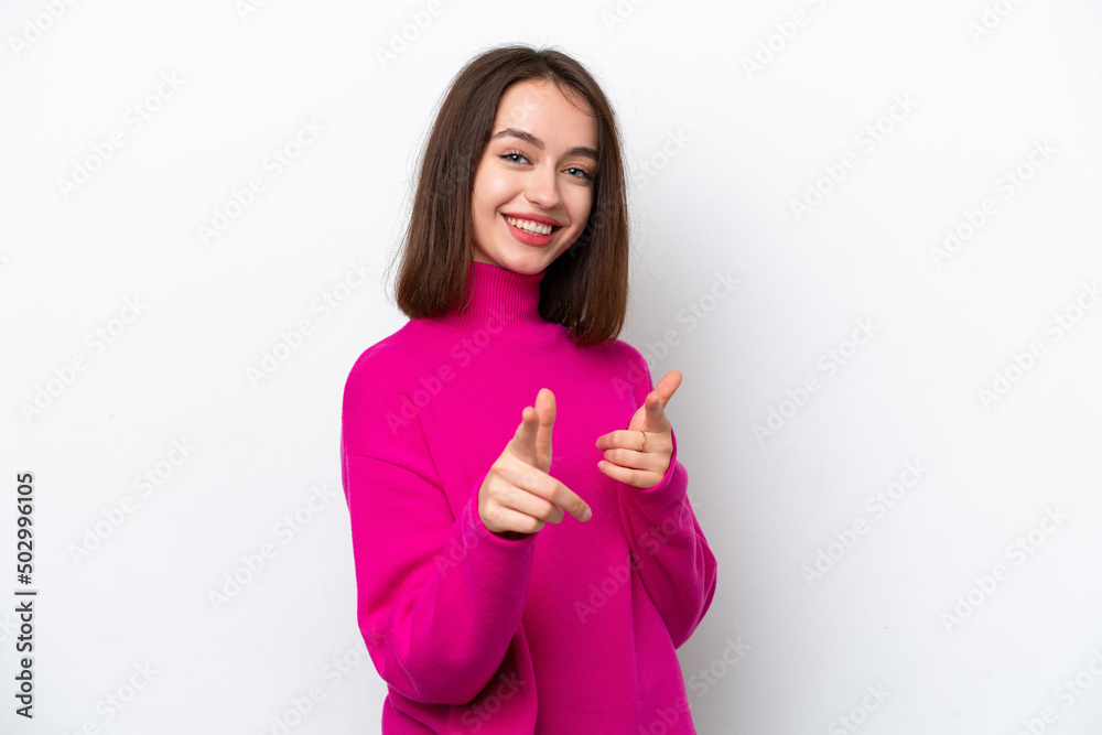 Young Ukrainian woman isolated on white background surprised and pointing front Young Ukrainian woman isolated on white background surprised and pointing front