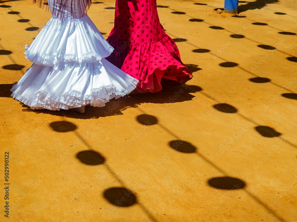 Naklejka premium Trajes de flamenca en la feria de Abril / In the April fair Flamenco dresses. Sevilla