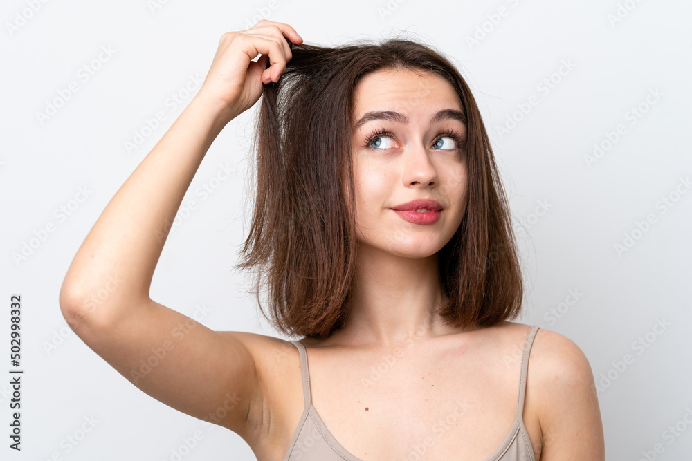 Young Ukrainian woman isolated on white background with tangled hair. Close up portrait Young Ukrainian woman isolated on white background with tangled hair. Close up portrait
