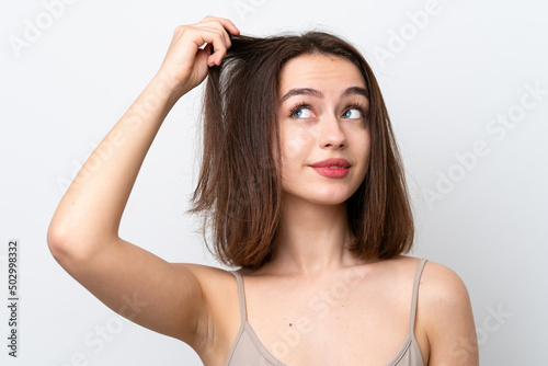 Young Ukrainian woman isolated on white background with tangled hair. Close up portrait