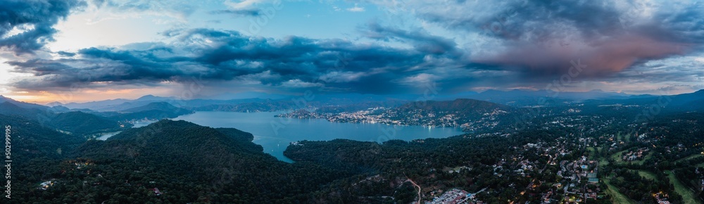 High altitude aerial photography with the drone of Valle de Bravo lake at sunset from Avandaro
